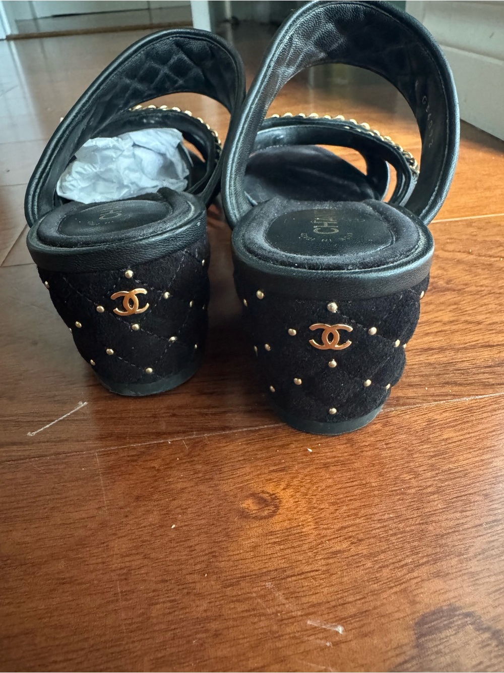 Authentic CHANEL Black Quilted Slide Mules with Gold Chain Trim